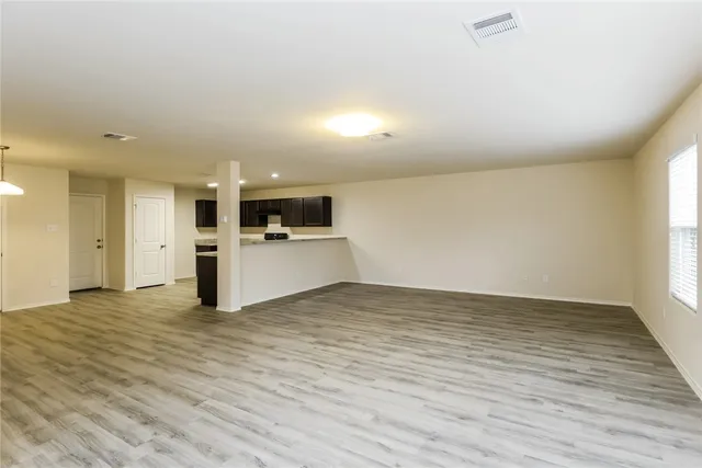 a view of a kitchen with a sink and a stove top oven