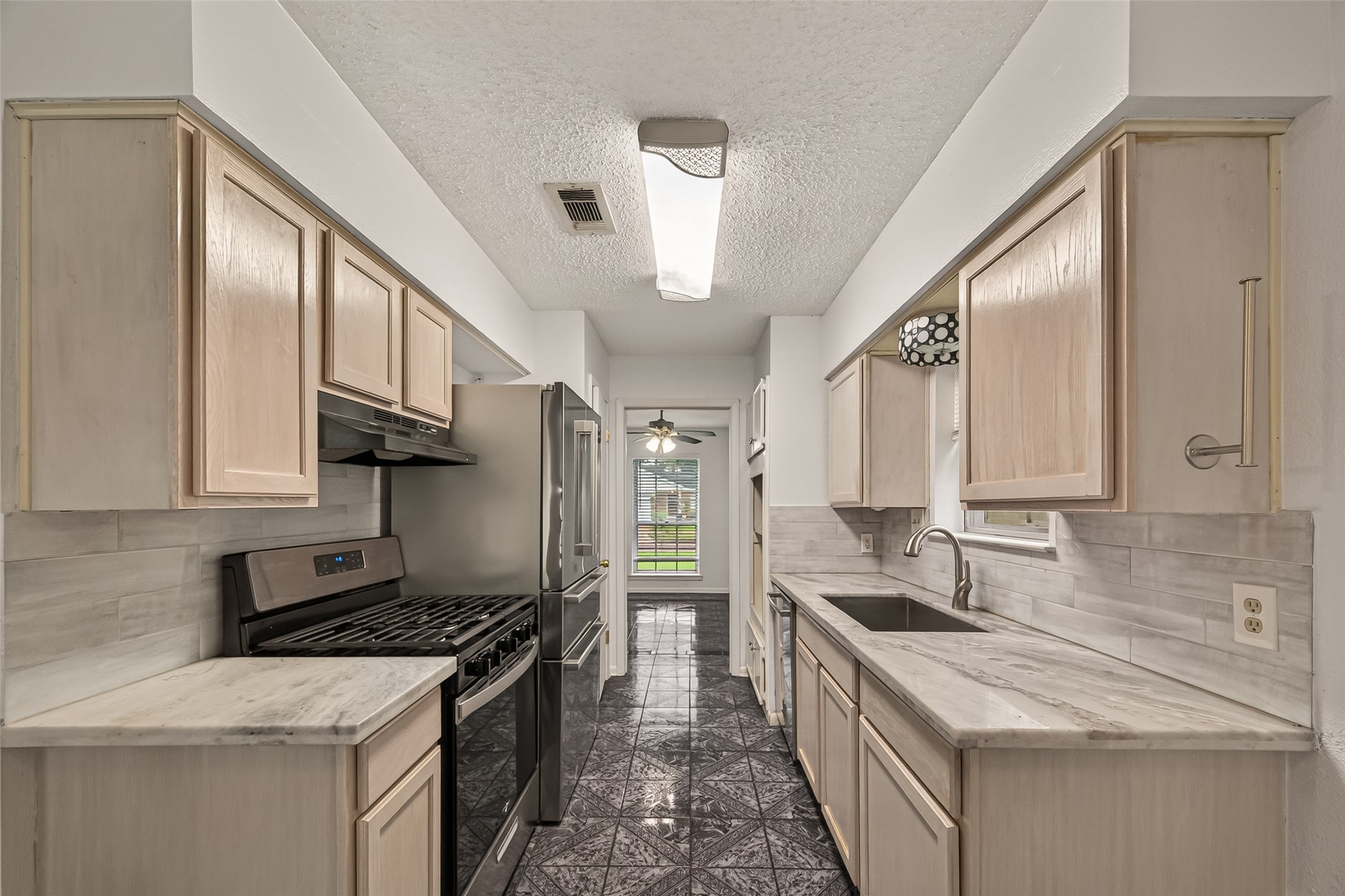 16219 Rill Lane Houston, TX 77062 - Photo 8 of 24 Gas range & tabletop microwave in the kitchen