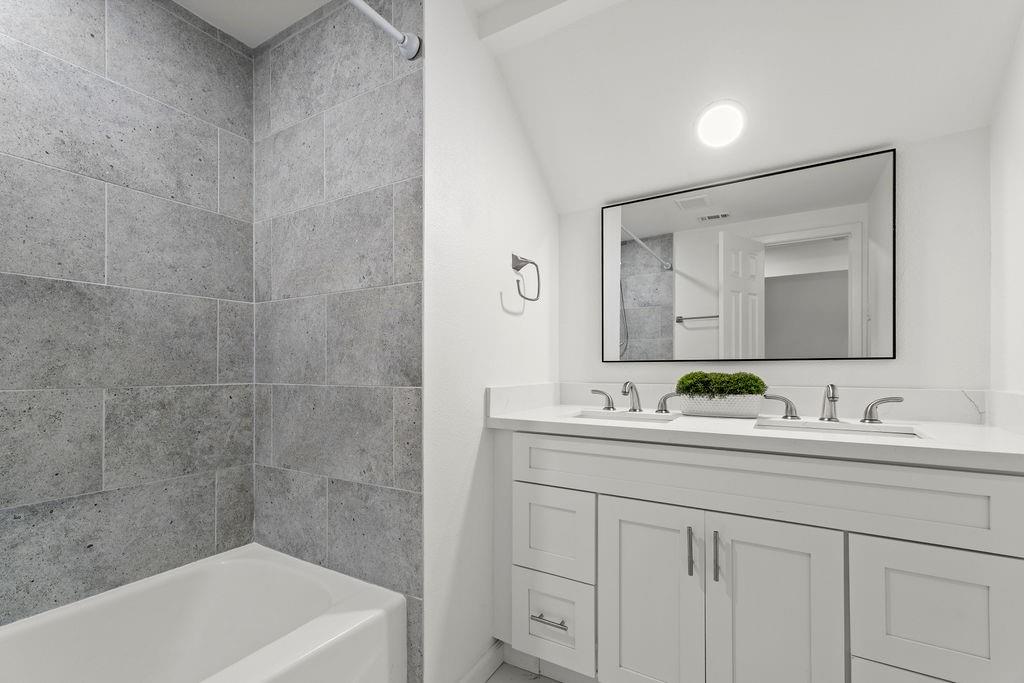 11022 Ferndale Road Dallas, TX 75238 - Photo 20 of 37 a bathroom with a double vanity sink mirror and bathtub