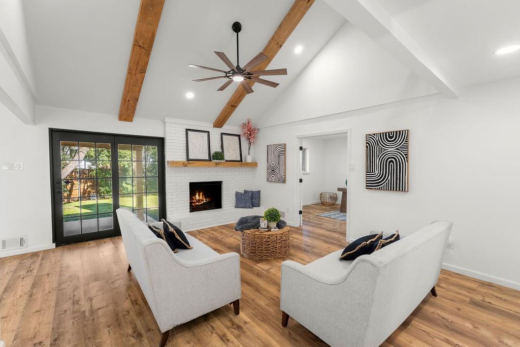 11022 Ferndale Road Dallas, TX 75238 - Photo 2 of 37 a living room with furniture and a fireplace