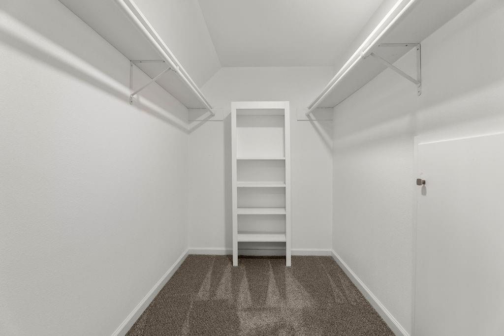 11022 Ferndale Road Dallas, TX 75238 - Photo 28 of 37 a view of an empty walk in closet