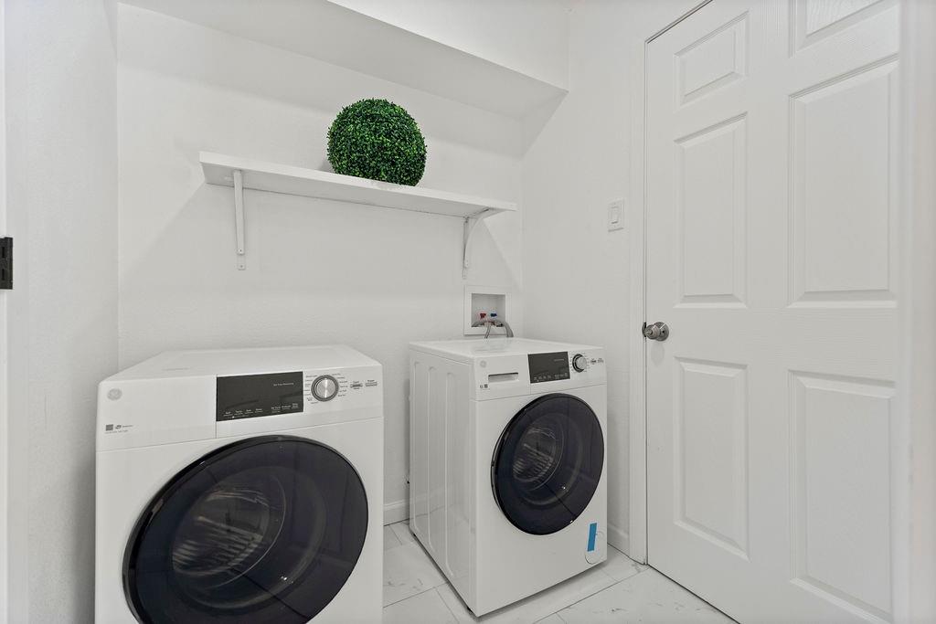 11022 Ferndale Road Dallas, TX 75238 - Photo 34 of 37 a view of washer and dryer in a utility room
