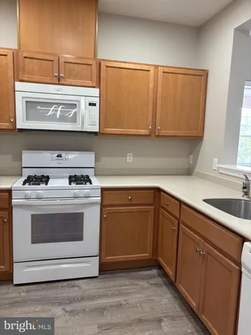 a kitchen with a stove and a sink