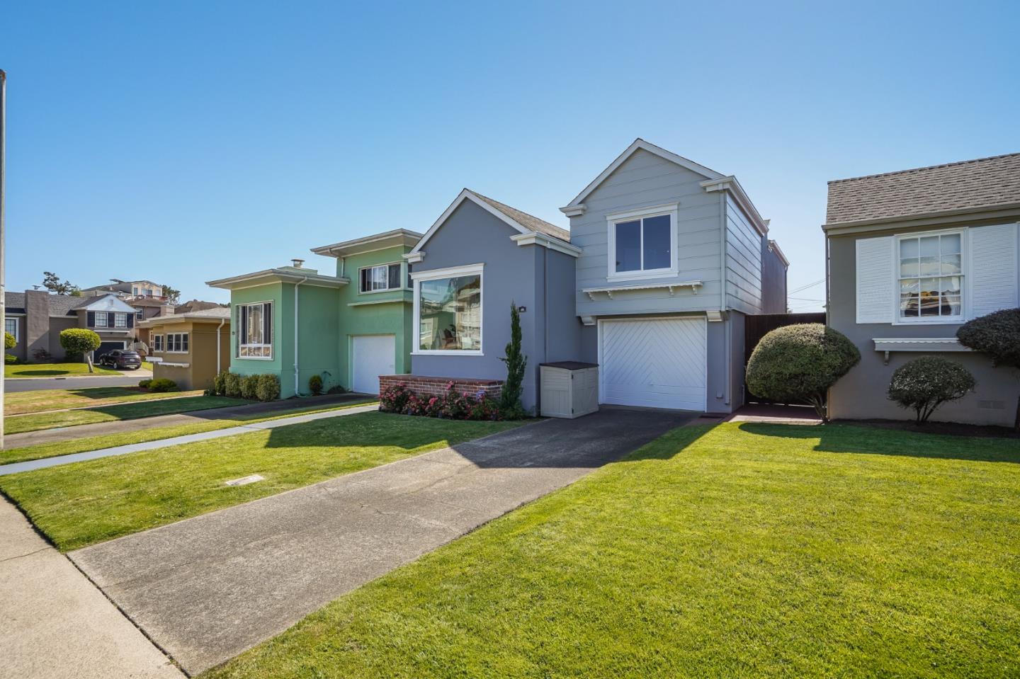 49 Sheffield Drive Daly City, CA 94015 - Photo 1 of 55 a front view of a house with a yard and garage