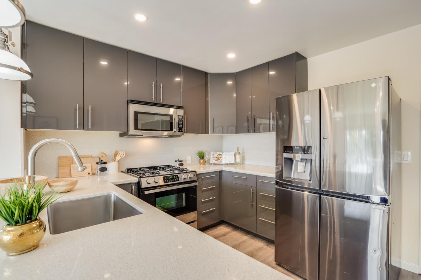 49 Sheffield Drive Daly City, CA 94015 - Photo 20 of 55 a kitchen with stainless steel appliances a refrigerator sink and microwave