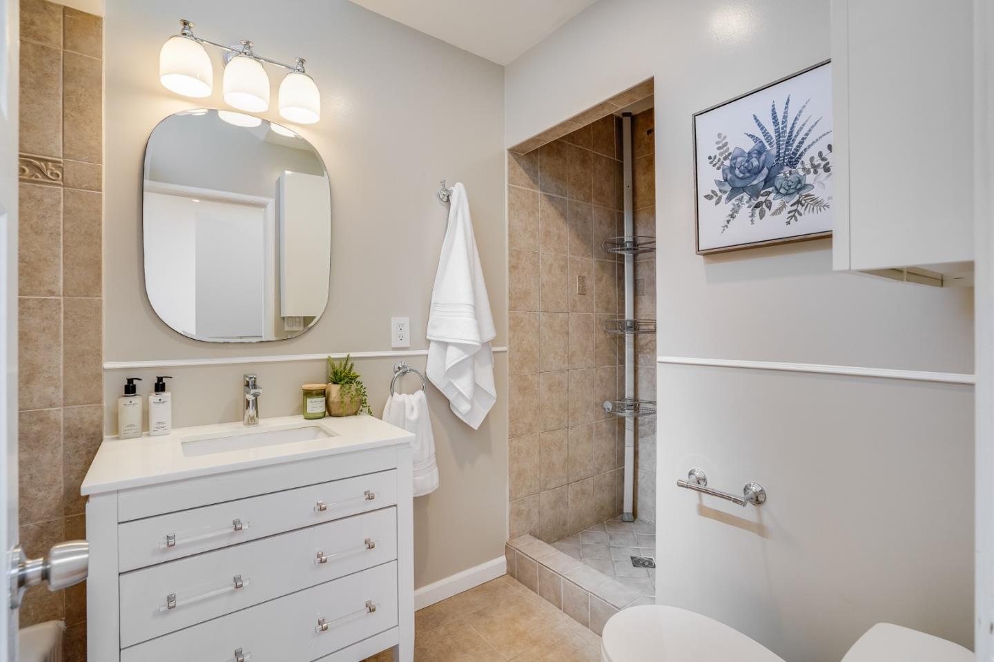 49 Sheffield Drive Daly City, CA 94015 - Photo 31 of 55 a bathroom with a double vanity sink toilet and a mirror
