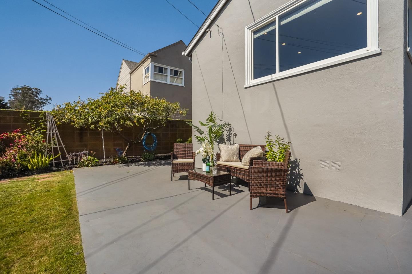 49 Sheffield Drive Daly City, CA 94015 - Photo 37 of 55 a view of a patio with couches and table and chairs with plants