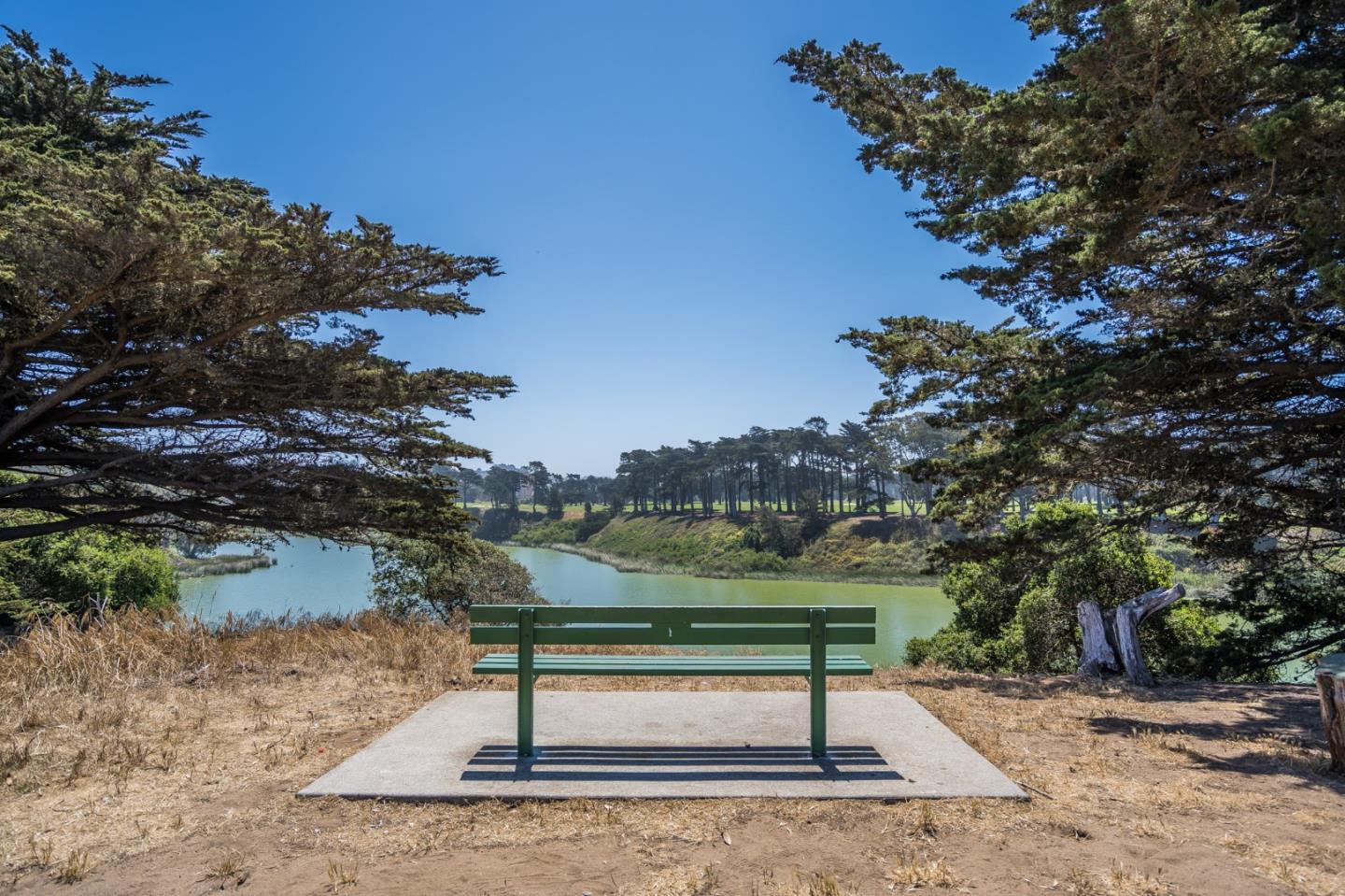 49 Sheffield Drive Daly City, CA 94015 - Photo 52 of 55 a park view with a bench and lake view