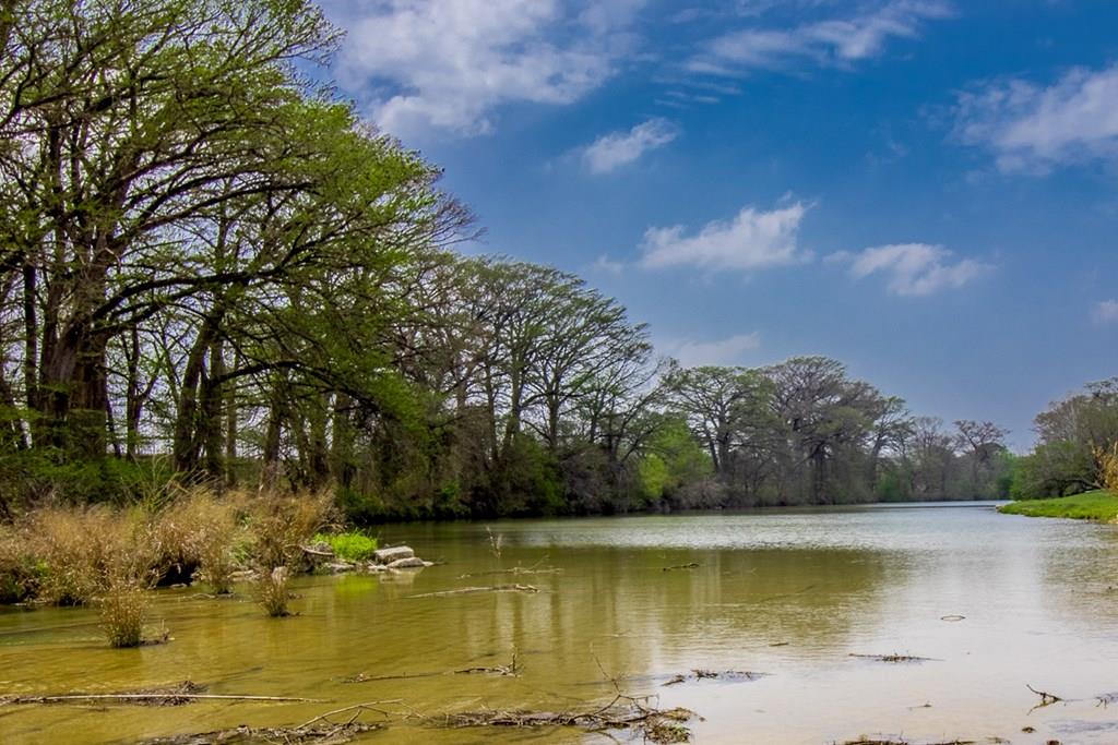 6515 Highway 27 Center Point, TX 78010 - Photo 1 of 48 a view of a lake with houses
