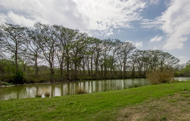 a view of lake with green space