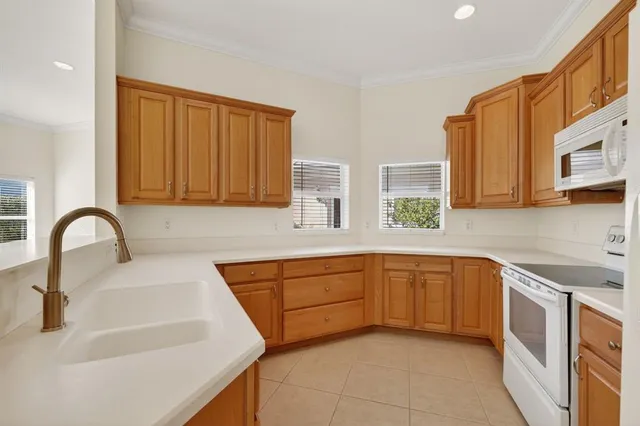an empty room with a ceiling fan and a window