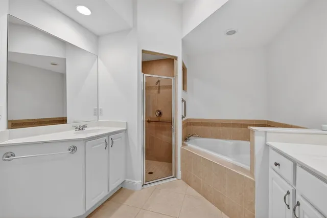 an empty room with chandelier fan