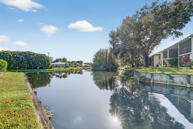 a view of house with outdoor space and sitting area