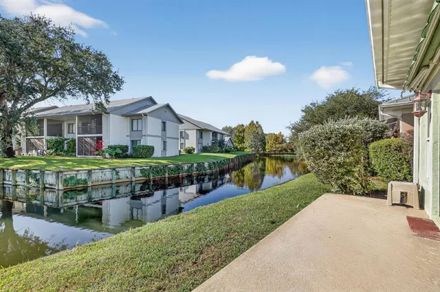 a view of a backyard with sitting area