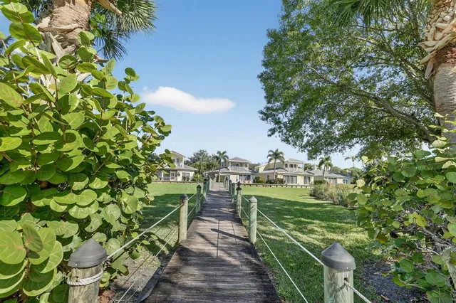 a view of a terrace with wooden floor and lake view