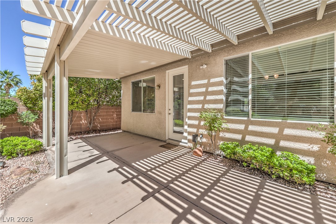 3713 Spring Shadow Road Las Vegas, NV 89129 - Photo 32 of 37 Enjoy outdoor living on this shaded patio, perfect for relaxing or entertaining.