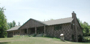 12278 County Line Road Roscoe, IL 61073 - Photo 1 of 1 a view of a house with a dry yard and large tree