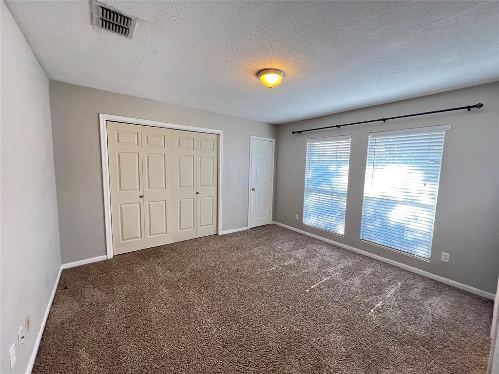 6151 Alpha Road Dallas, TX 75240 - Photo 19 of 39 an empty room with windows