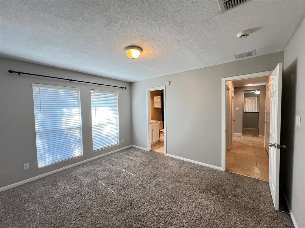 6151 Alpha Road Dallas, TX 75240 - Photo 20 of 39 an empty room with windows