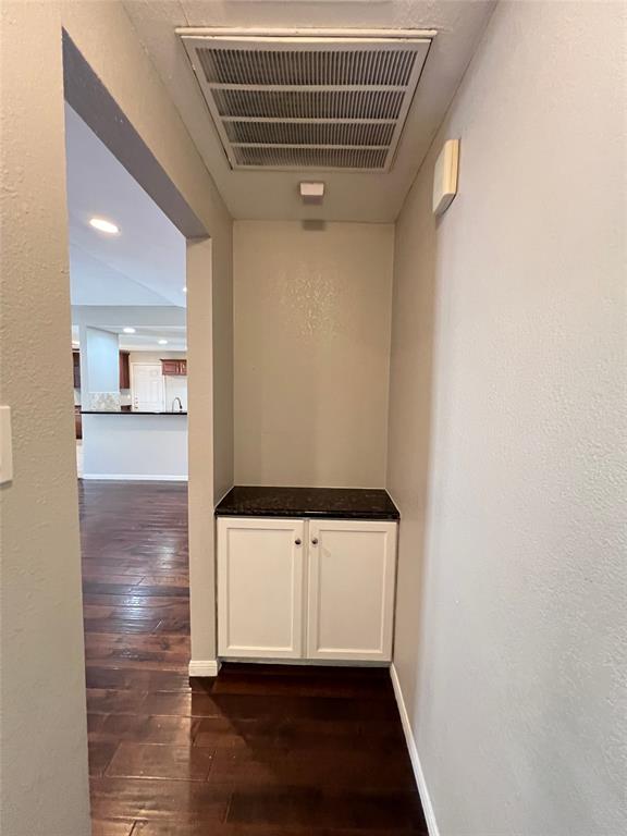 6151 Alpha Road Dallas, TX 75240 - Photo 25 of 39 a view of a hallway with wooden floor