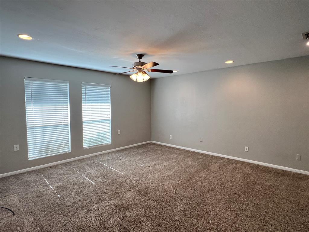 6151 Alpha Road Dallas, TX 75240 - Photo 29 of 39 a view of an empty room with a chandelier fan