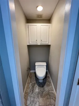 a bath tub sitting in a bathroom next to a sink