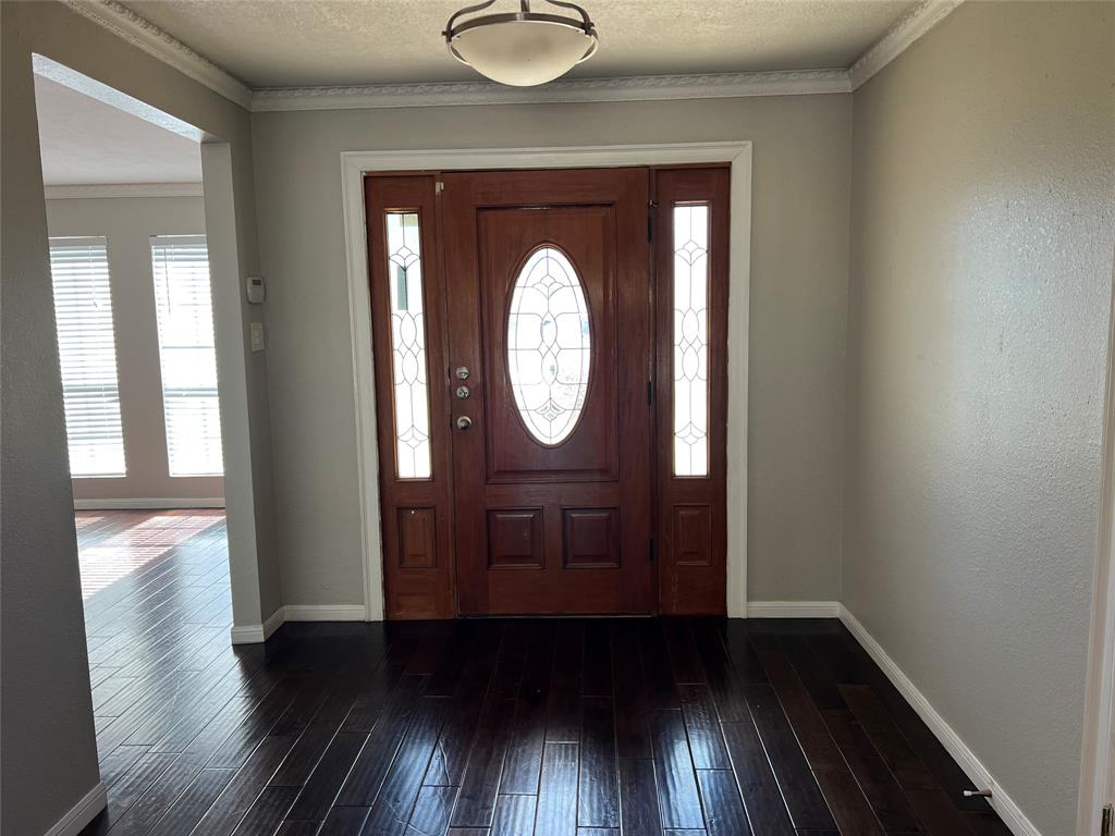 6151 Alpha Road Dallas, TX 75240 - Photo 4 of 39 a view of a hallway with wooden floor