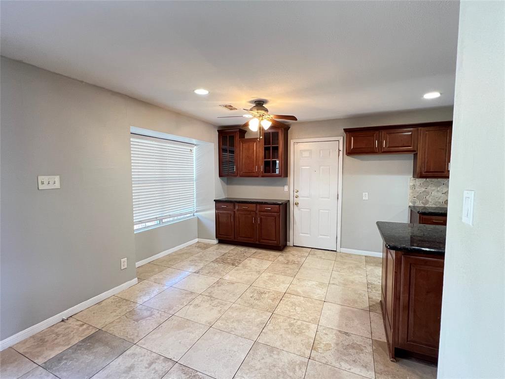6151 Alpha Road Dallas, TX 75240 - Photo 9 of 39 a view of a kitchen with a sink and a window