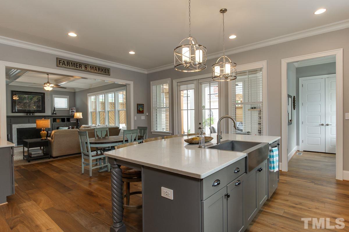 2315 Bedford Avenue Raleigh, NC 27607 - Photo 11 of 25 a kitchen with center island table and chairs