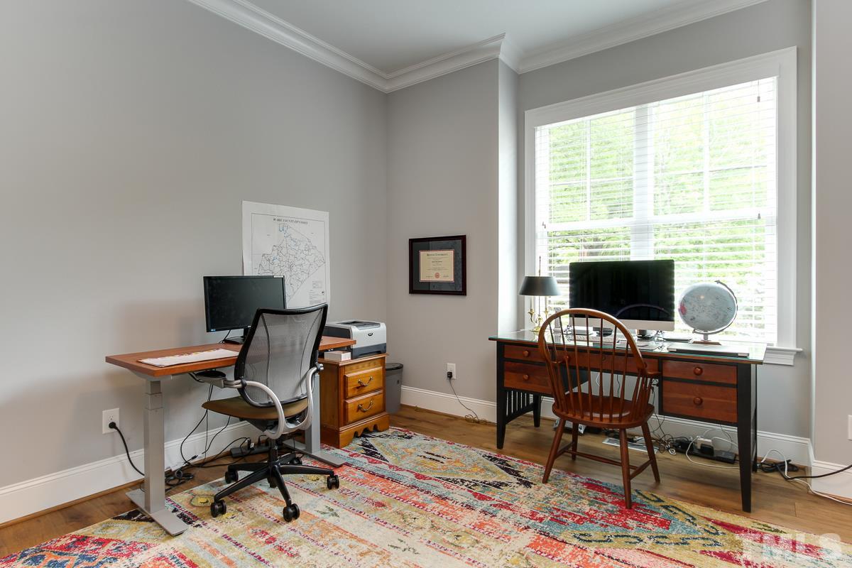 2315 Bedford Avenue Raleigh, NC 27607 - Photo 13 of 25 a view of a workspace with furniture and a window