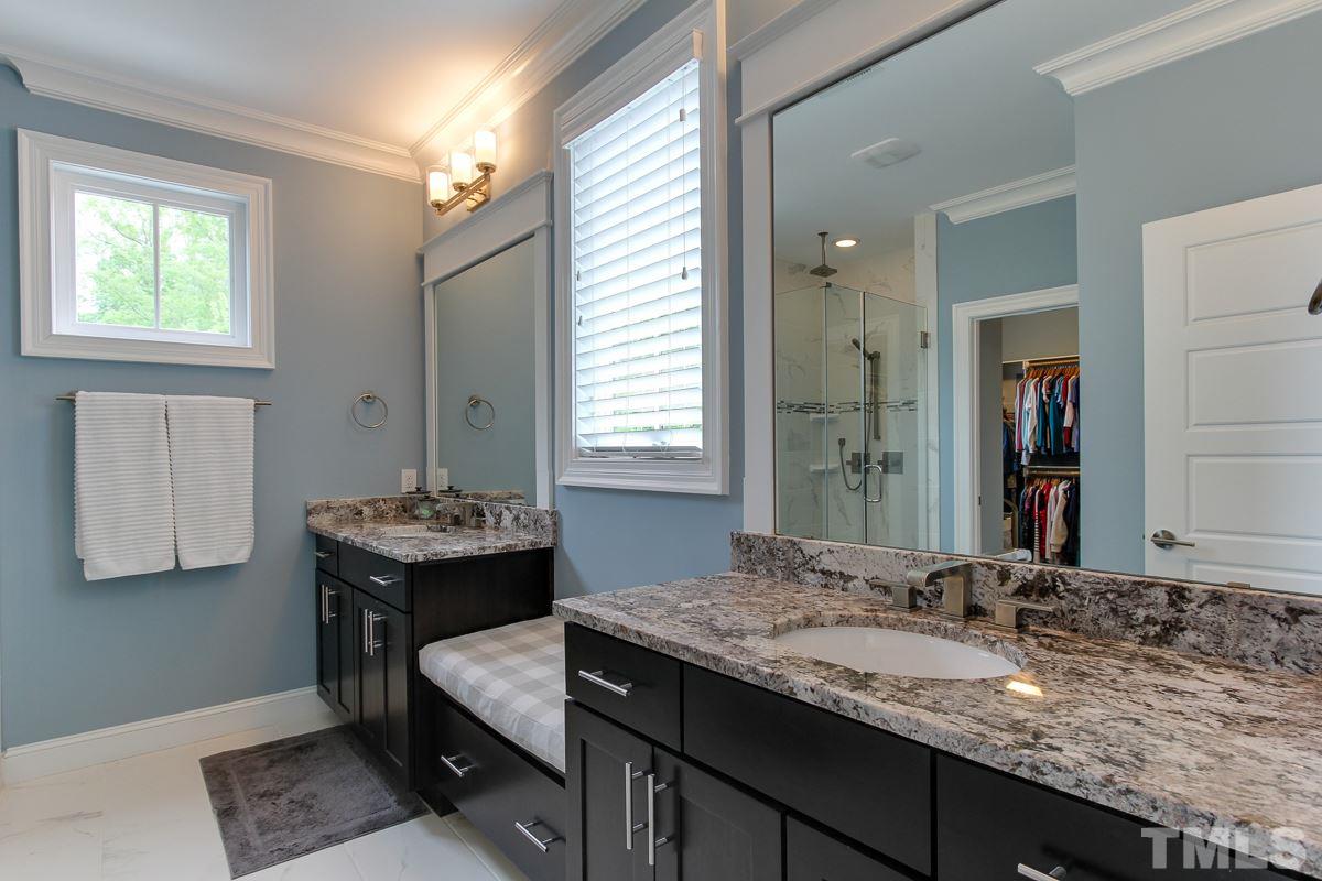 2315 Bedford Avenue Raleigh, NC 27607 - Photo 16 of 25 a bathroom with a granite countertop sink and a mirror
