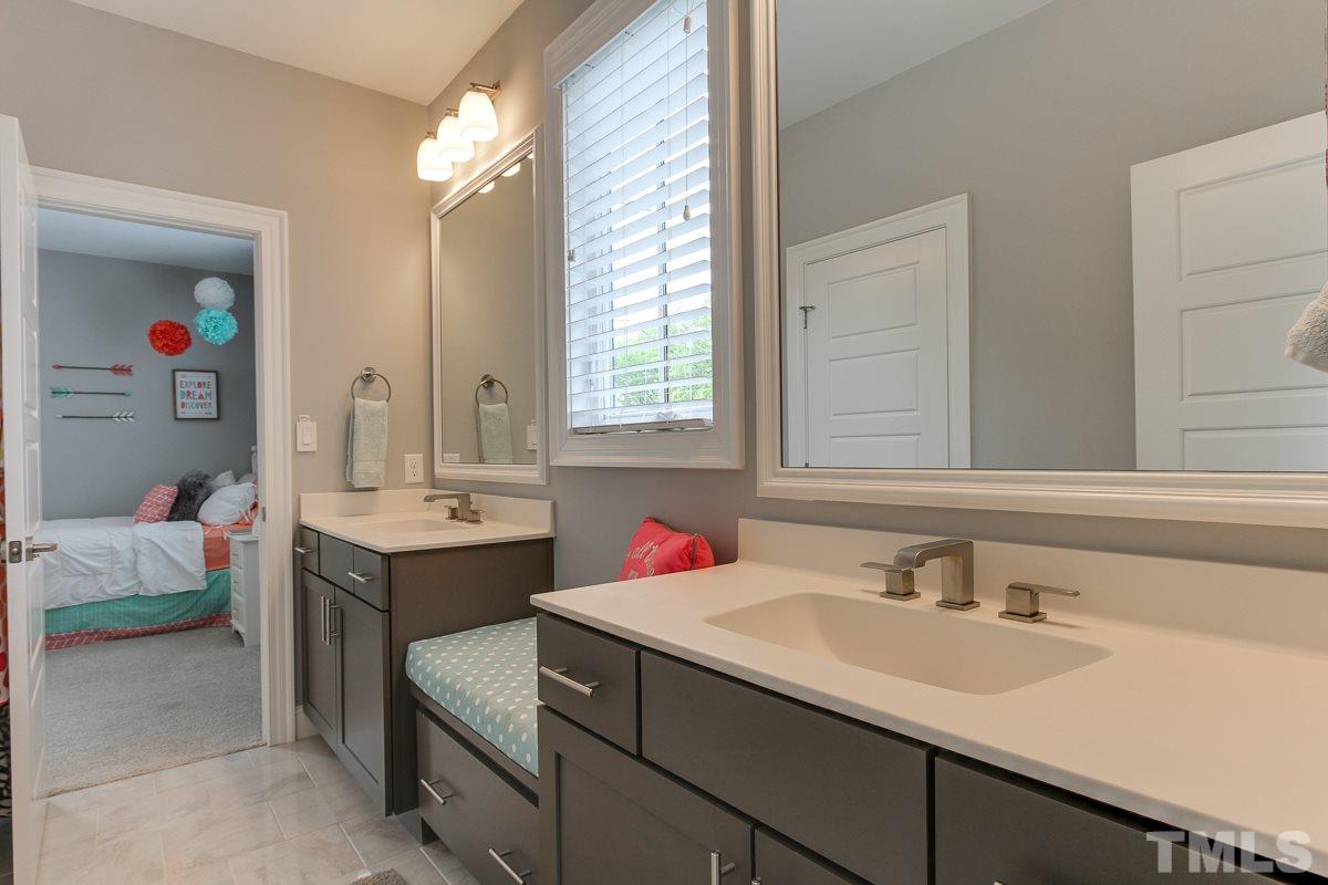 2315 Bedford Avenue Raleigh, NC 27607 - Photo 20 of 25 a bathroom with a sink and a mirror