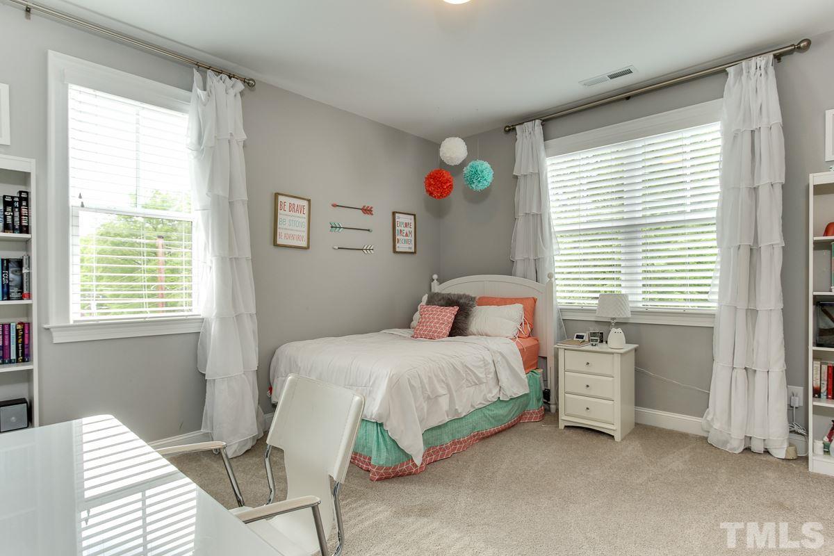 2315 Bedford Avenue Raleigh, NC 27607 - Photo 21 of 25 a bedroom with a bed and a window