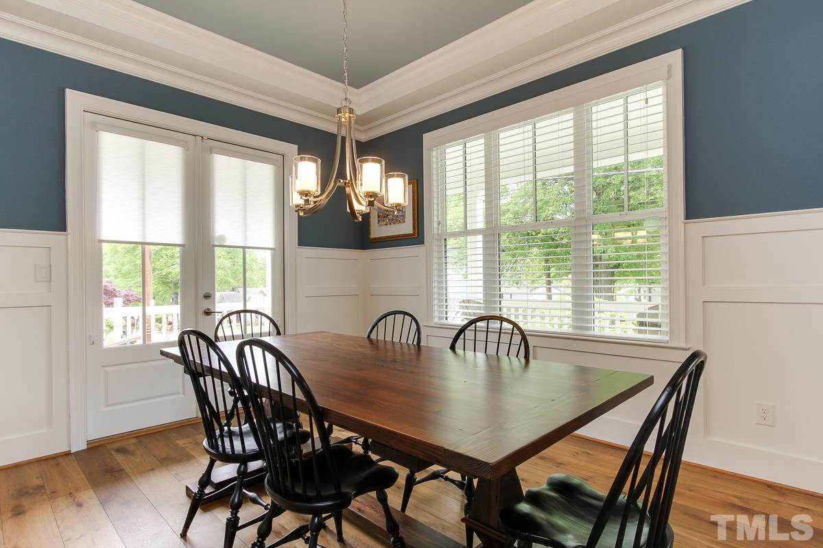 2315 Bedford Avenue Raleigh, NC 27607 - Photo 4 of 25 a dining room with furniture a window and a chandelier