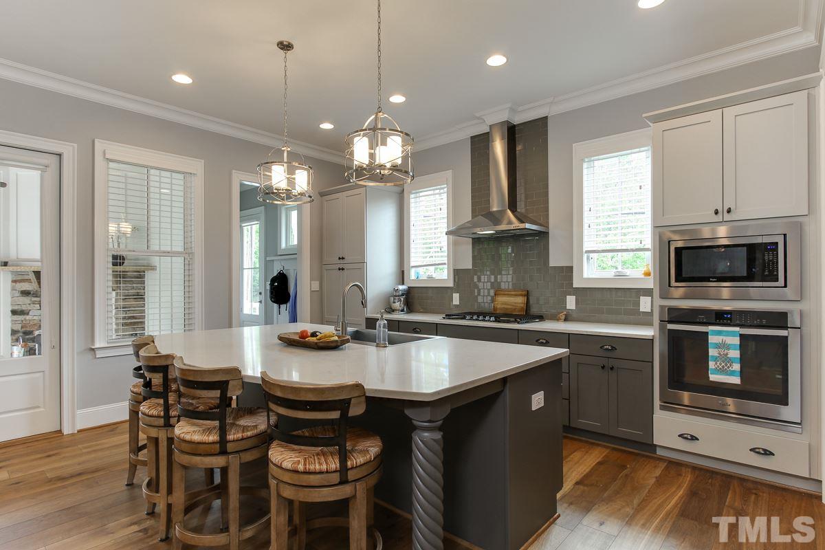 2315 Bedford Avenue Raleigh, NC 27607 - Photo 10 of 25 a large kitchen with a table and chairs in it