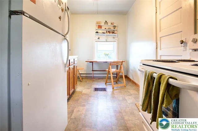 a bedroom with a bed and a mirror