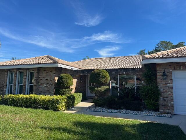 20203 Back 9 Drive Boca Raton, FL 33498 - Photo 1 of 1 a front view of a house with a yard
