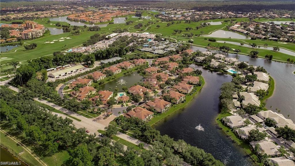 6135 Reserve Circle, Unit 1801 Naples, FL 34119 - Photo 7 of 23 Aerial view of property's location featuring a large body of water, nearby suburban area, and a golf club
