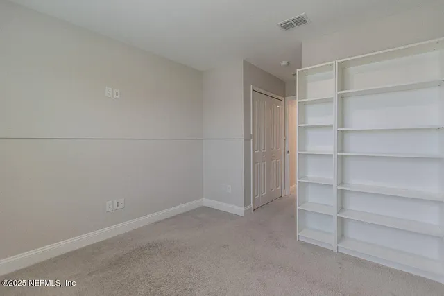 a view of an empty walk in closet