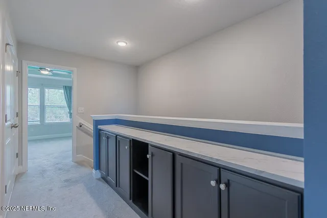 a view of storage and utility room with closet