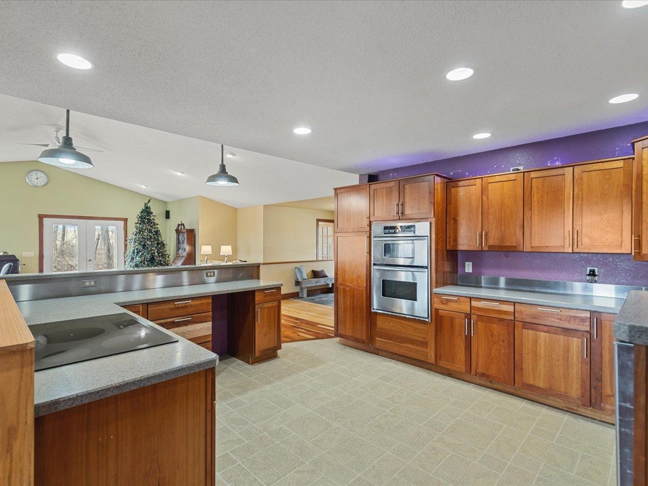 11660 Farm School Road Durand, IL 61024 - Photo 11 of 47 a kitchen with stainless steel appliances granite countertop sink stove and refrigerator