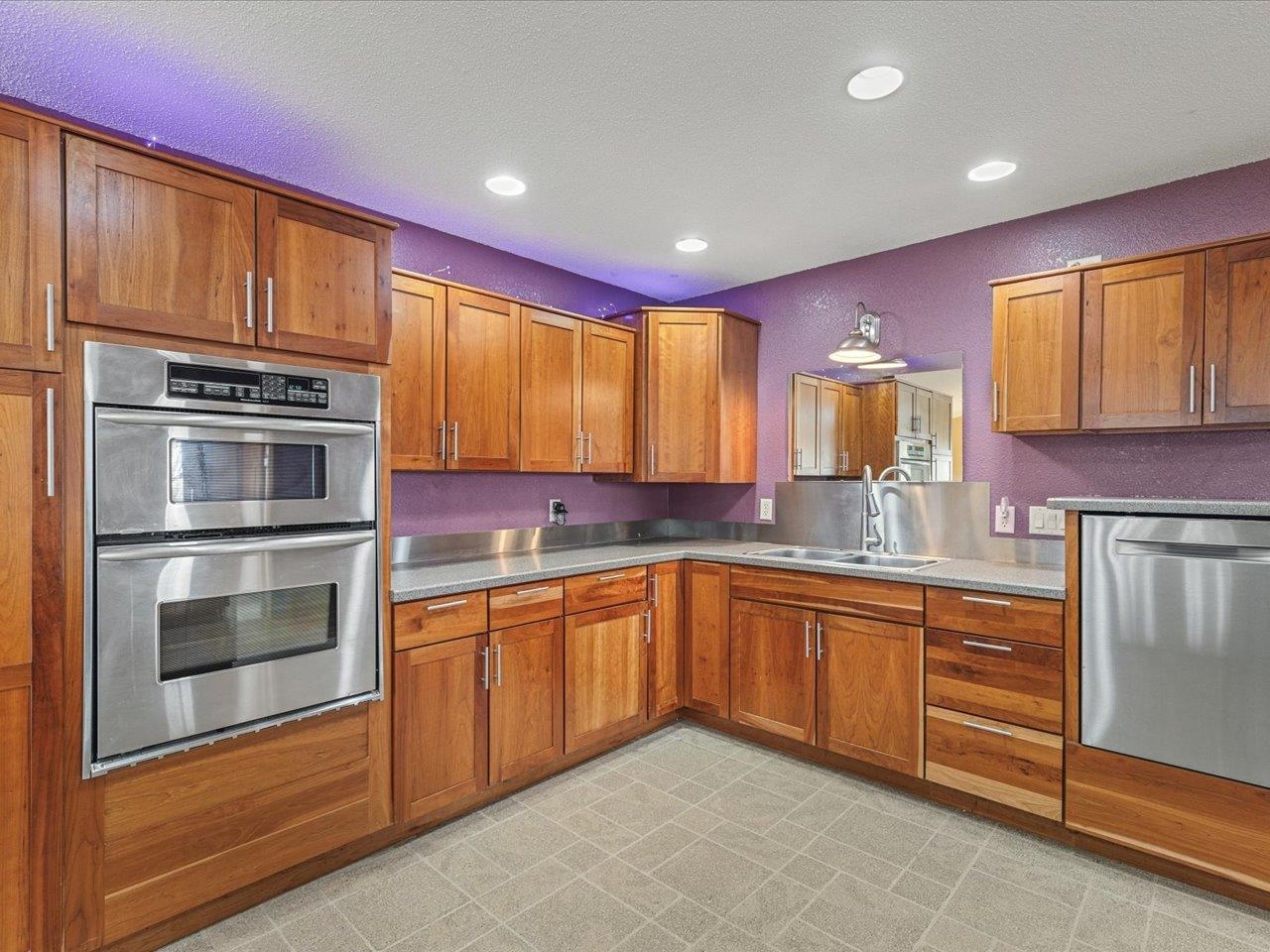 11660 Farm School Road Durand, IL 61024 - Photo 12 of 47 a kitchen with stainless steel appliances granite countertop a stove and cabinets