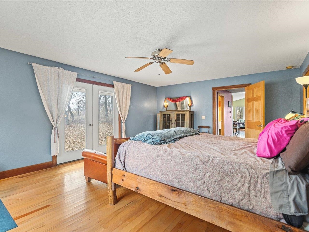 11660 Farm School Road Durand, IL 61024 - Photo 17 of 47 a bedroom with a bed and a mirror
