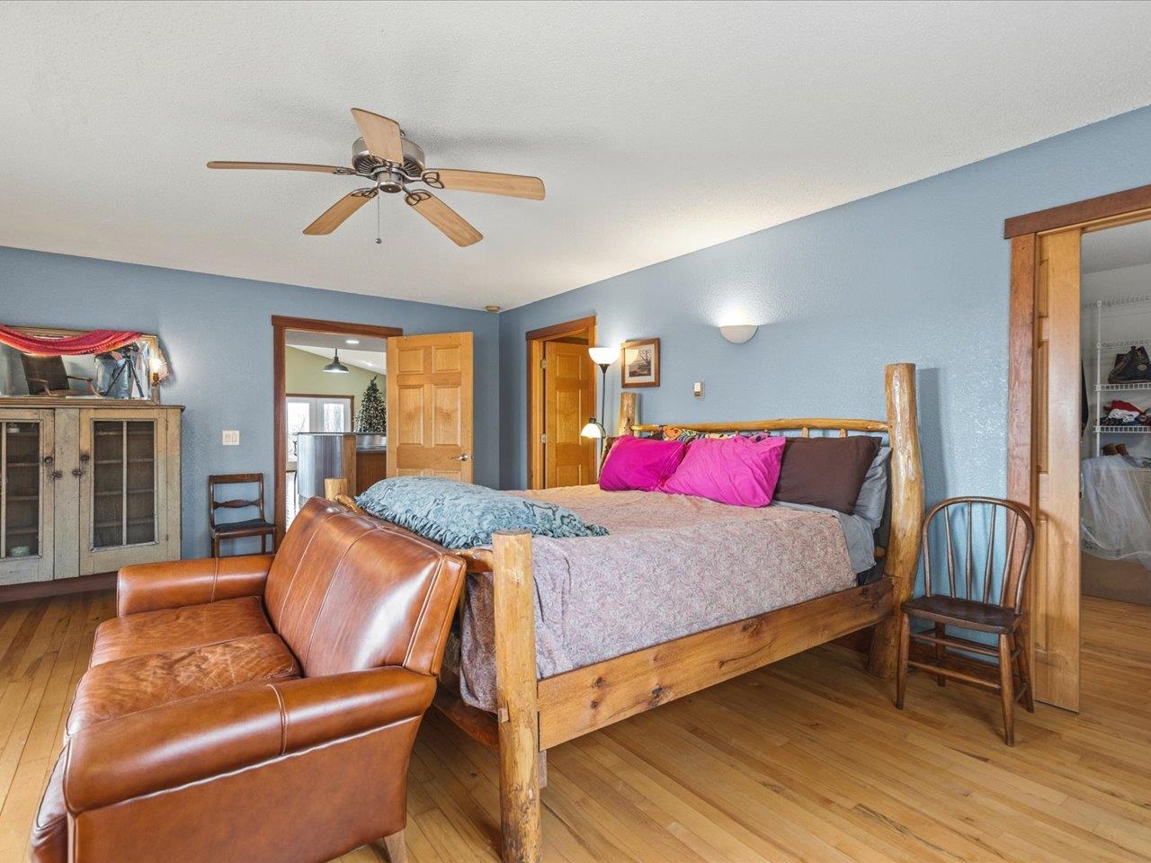 11660 Farm School Road Durand, IL 61024 - Photo 18 of 47 a bedroom with a bed and wooden floor