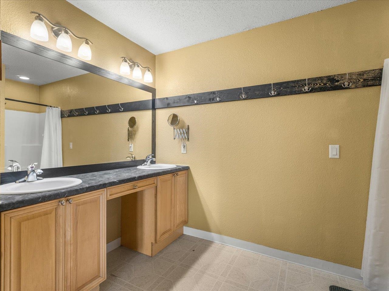 11660 Farm School Road Durand, IL 61024 - Photo 19 of 47 a bathroom with a sink and a mirror