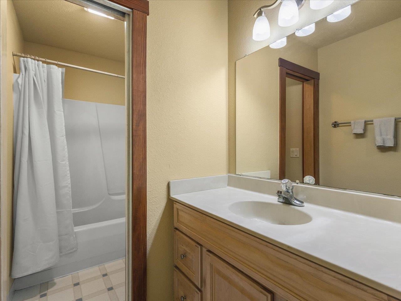 11660 Farm School Road Durand, IL 61024 - Photo 23 of 47 a bathroom with a sink and a mirror