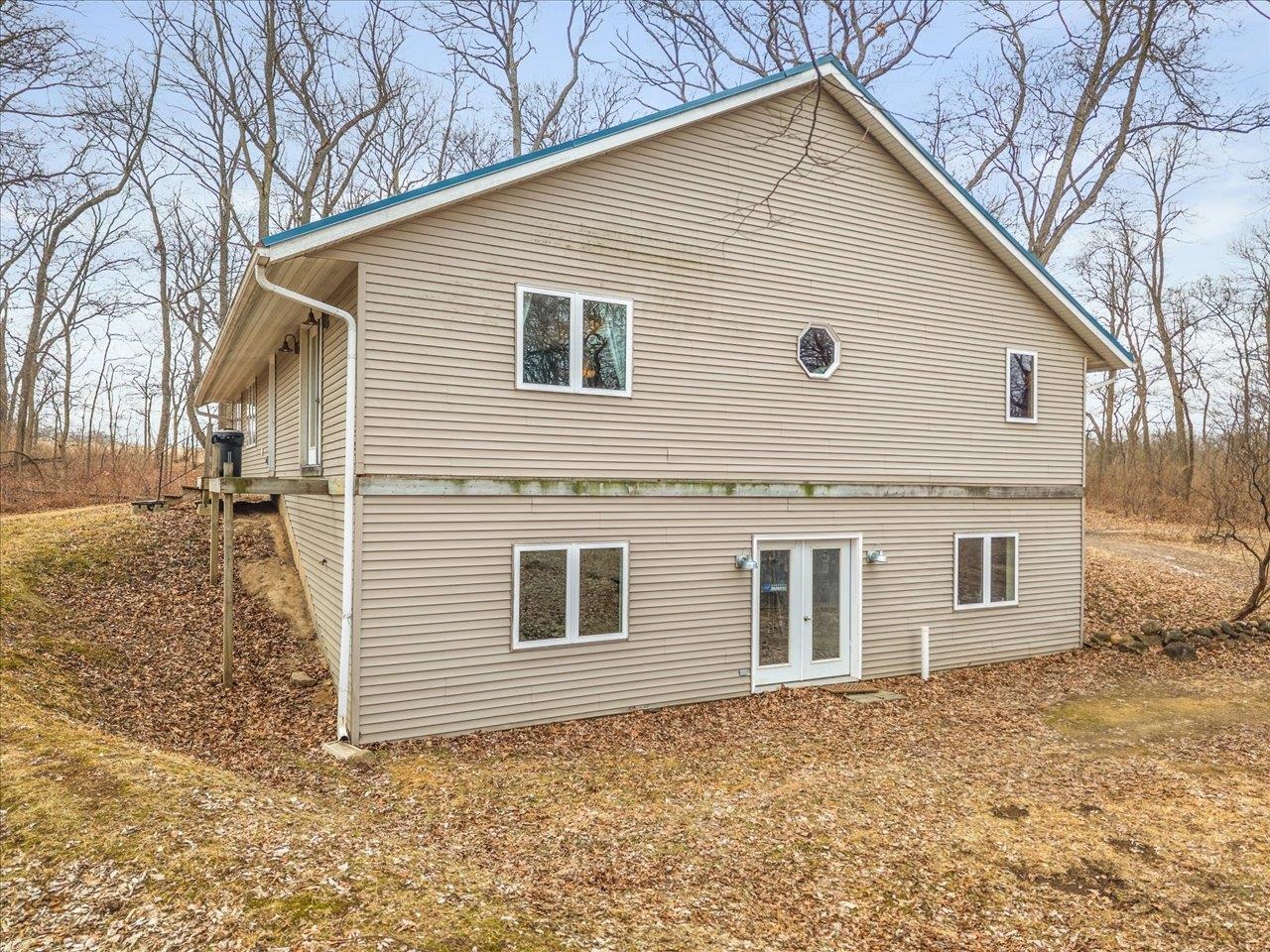 11660 Farm School Road Durand, IL 61024 - Photo 31 of 47 a view of a house with a yard