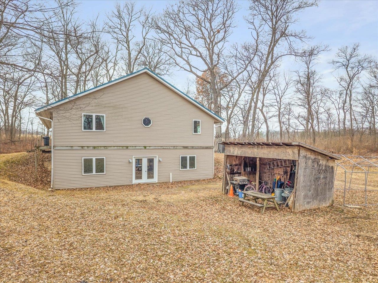11660 Farm School Road Durand, IL 61024 - Photo 34 of 47 a view of a house with backyard and chairs