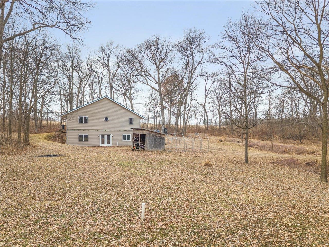 11660 Farm School Road Durand, IL 61024 - Photo 35 of 47 a front view of a house with a yard