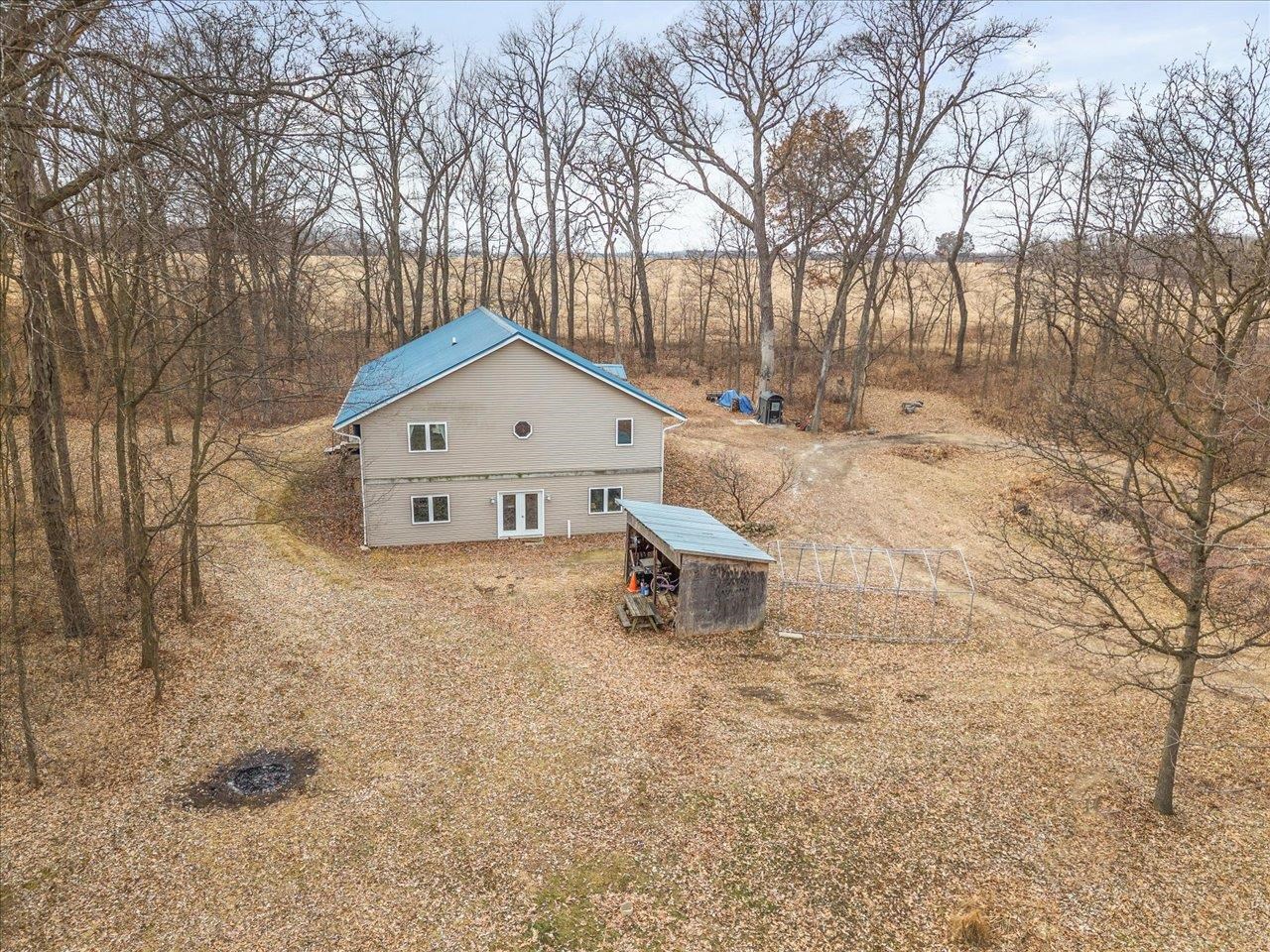 11660 Farm School Road Durand, IL 61024 - Photo 36 of 47 a white house covered with snow in the background